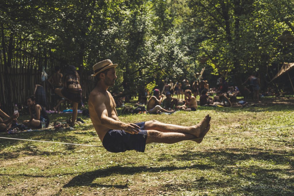 Man sitting on slackline at Modem festival
